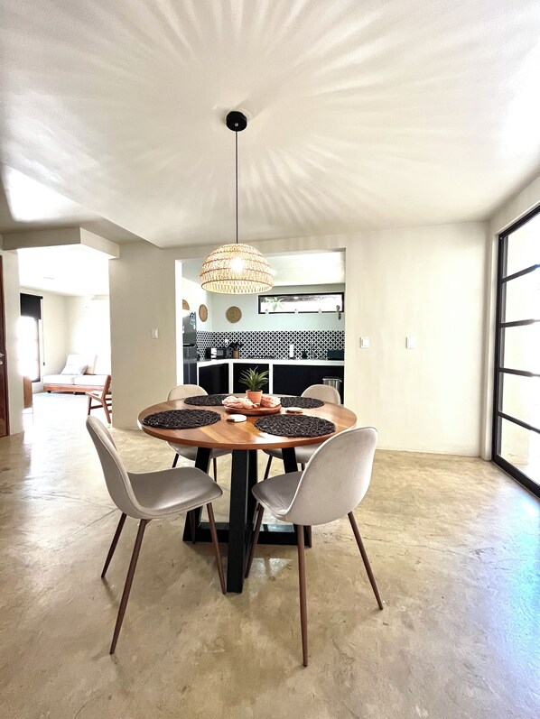 Dining Room with view Ito kitchen and living room