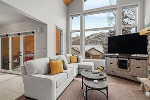 Living room with ski mountain views, short walk to Gondola Square!