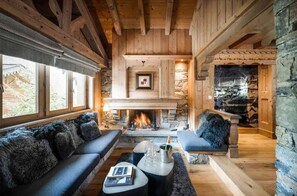 Take a seat in front of the fireplace and enjoy the living area.