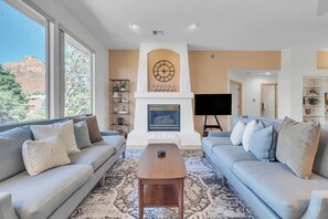 Living room with cozy furnishings,  gas fireplace and a Smart TV