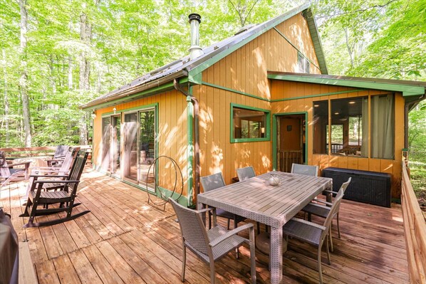Lovely outdoor deck wraps around more than half of the house!