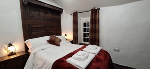 Double bedroom with double half-tester bed.