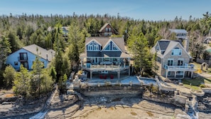 Perched above rocky shores, this stunning cottage features a wraparound deck and direct lake access—perfect for sunsets, BBQs, and relaxation.