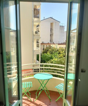 Small sunny balcony. Great for breakfast!