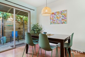 Dining area for 6 near the outdoor patio with grill and seating