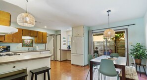 Bar seating and dining area in the spacious fully equipped kitchen