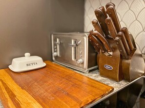 Sharp knives and cutting boards are a kitchen staple.