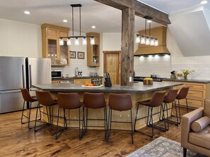 Chef's kitchen! Two refrigerators, stoves, and dishwashers, plus an oversized island!