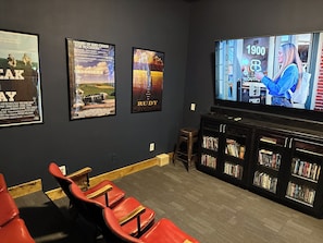 Watch your favorite movies on the big screen in our 100 year old antique theater seats