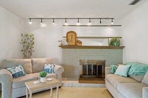 Stretch out, relax, or pull out a little extra comfort—our living room's got space for all your lounging needs!