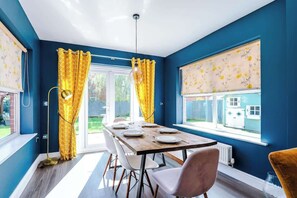 This dining room is connected to the kitchen, which is perfect for breakfast in the morning.