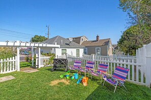 Let the kids enjoy lawn games in this fenced backyard!