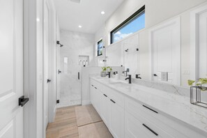 The Master Bath features stunning tile and spa-like amenities.