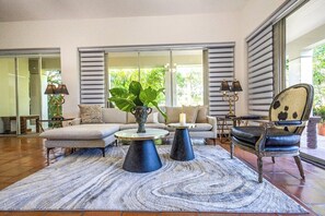 Comfortable couches and arm rest for TV watching or just to kick back and relax
Air-conditioned plus ceiling fan.
Huge, granite-topped coffee table on a carved wooden base
Credenza