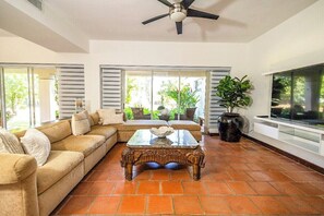 Large, flat-screen TV
Ample, comfortable couches for TV watching or just to kick back and relax
Air-Conditioned plus ceiling fan.
Huge, granite-topped coffee table on a carved wooden base
Credenza