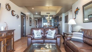 The living room and kitchen .