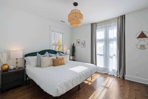Tranquil bedroom with cozy bedding and stylish decor, offering a peaceful retreat for a restful night's sleep.