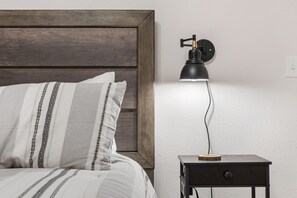 The king suite offers a private en suite, Smart TV, & access to the patio