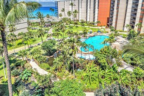 Dive into the resort-style pool at Kaanapali Shores 746, nestled among lush tropical landscaping.