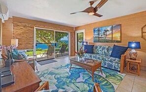 Tropical living room with lanai & ocean views at Kahana Sunset B4B.