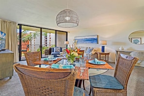 Dine in style at Kaanapali Shores 544 with wicker chairs and tropical views just outside.