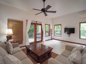 Comfortable living area overlooking luscious garden