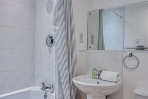Bathroom with complimentary toiletries provided.