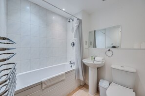 Bathroom with complimentary toiletries provided.