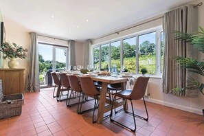 The dining table seats up to 10 people and is ideal for a sit-down meal in the evening with family and friends. There is also a separate desk and chair for those needing to work whilst away.