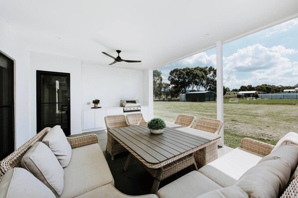 The BBQ, cool breezes and rural horizon come together to provide a transporting experience in the undercover patio. 