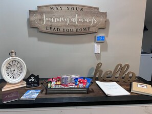 Table with guestbook, Things To Do Guide, and snacks