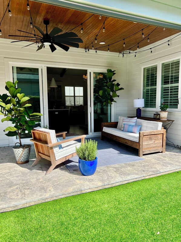 Covered patio with bistro lights