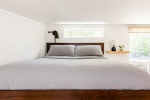 Roomy loft with five-foot ceilings and great natural lighting; reading lights on both sides of the bed