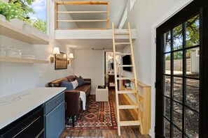 View of the ladder up to the loft; super sturdy but make sure you're comfortable with a ladder up to bed before booking!