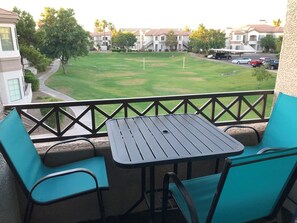 Patio overlooks an open green space