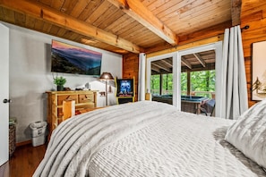 Main level queen bedroom, steps away from the hot tub with amazing forest views