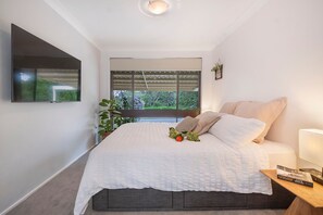 Master bedroom includes its own TV. No more fighting over the remote or sitting through cartoons.