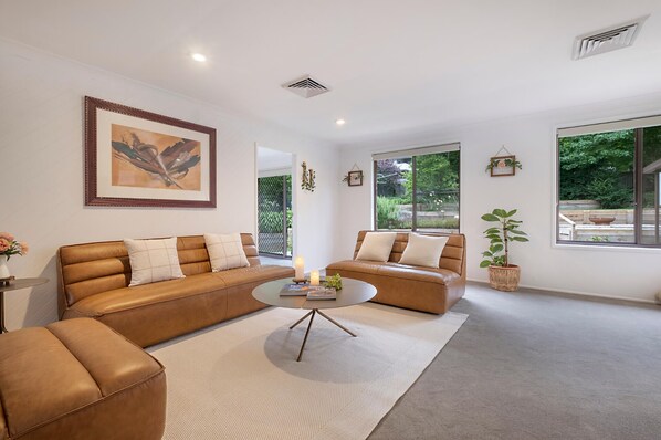 Relax and sink into comfy leather sofas and ottoman in the lounge.