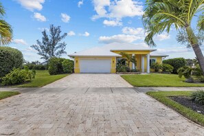 The private home offers parking for two cars in the driveway and one in the garage.