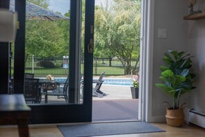 3 Sliding Glass Doors invite you to explore the outdoors.