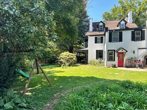 Outdoor Spacious Lawn Area (view from driveway) with Main Red Door Entrance