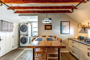 A lovely dining area is provided in the kitchen as well as stacked washer and dryer for guest use, a real help for longer stays!