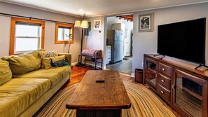 spacious and fully equipped living room is a cozy space for movie nights or rainy days