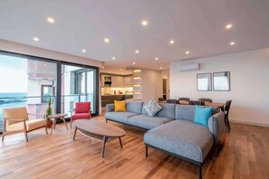 The living room and kitchen