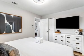  Bedroom 1, features a king bed an en-suite bathroom, and smart TV. 