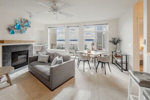 Bright, open living space, dining area and workspace area