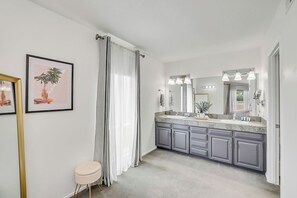 Master bathroom - His and hers sink, walk-in closet and large standing mirror