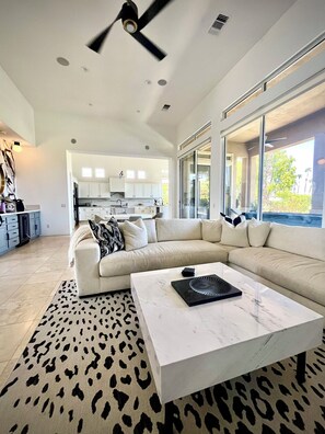 Open concept living room with pool views!