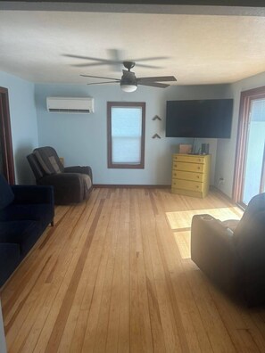 Living room with 2 recliners and couch large tv