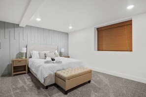 Queen Size Bed with Down Comforter and USB Chargers in Nightstand